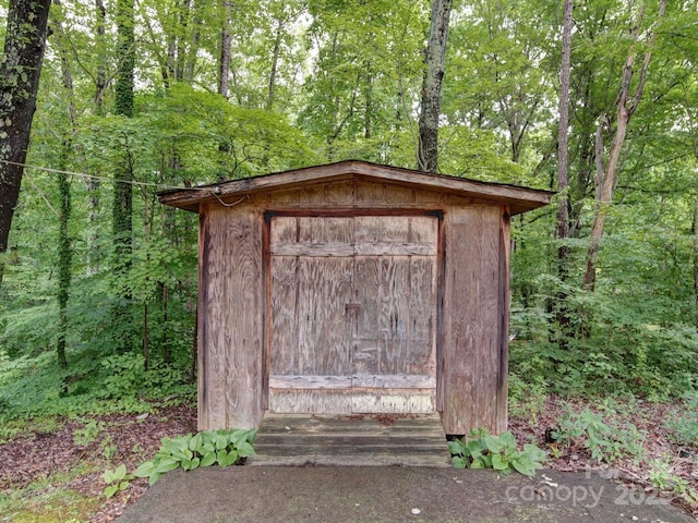 167 Cedar Ln, Troutman, NC 28166 - view of shed featuring a forest view