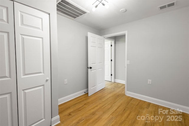 307 S Ransom St, Gastonia, NC 28052 - unfurnished bedroom featuring visible vents, baseboards, and light wood-style floors