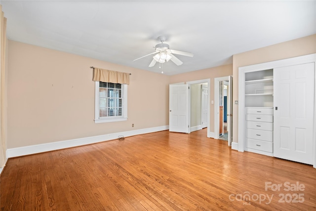 431 Sullivan Rd, Statesville, NC 28677 - unfurnished bedroom with light wood-type flooring, baseboards, a ceiling fan, and a closet