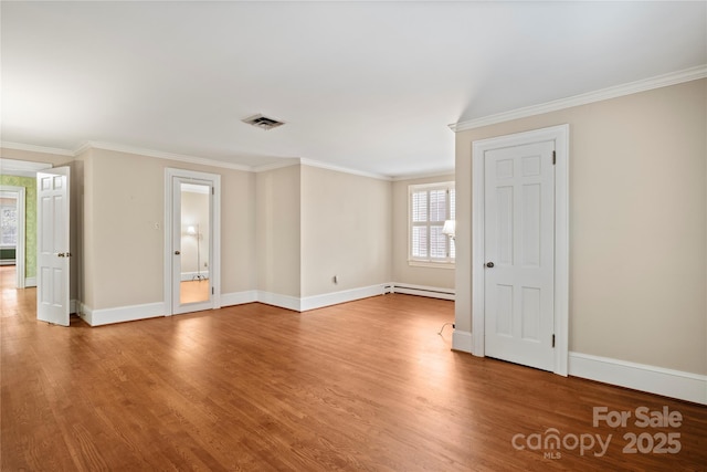 431 Sullivan Rd, Statesville, NC 28677 - unfurnished room with a baseboard radiator, ornamental molding, wood finished floors, and baseboards