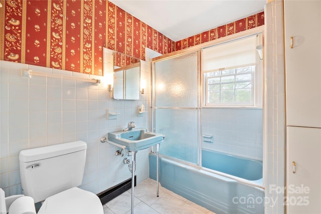 431 Sullivan Rd, Statesville, NC 28677 - full bathroom with toilet, tile walls, combined bath / shower with glass door, and wallpapered walls
