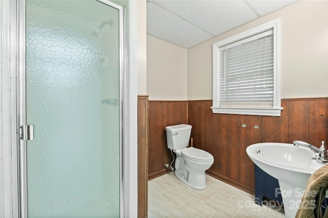 431 Sullivan Rd, Statesville, NC 28677 - bathroom featuring a wainscoted wall, a stall shower, toilet, and wood walls