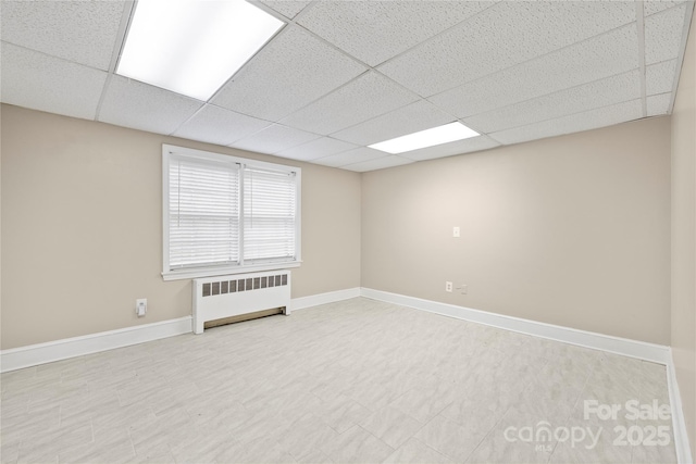 431 Sullivan Rd, Statesville, NC 28677 - spare room with radiator, a drop ceiling, and baseboards