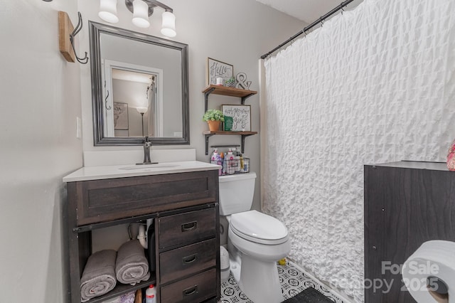 full bathroom with toilet and vanity