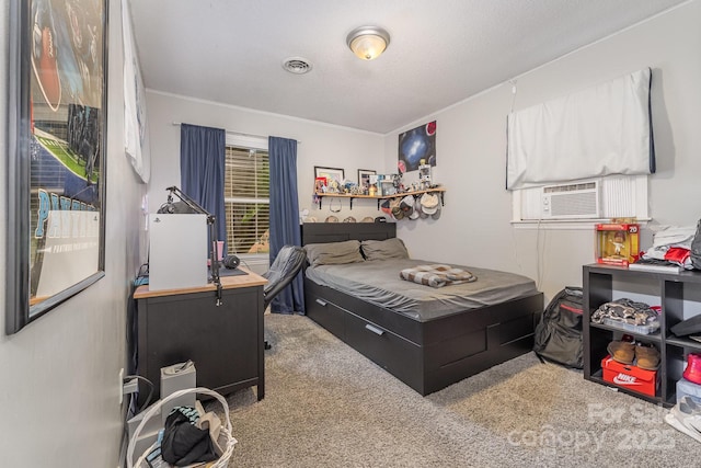 bedroom featuring visible vents, cooling unit, crown molding, and carpet floors