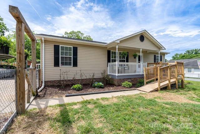 view of front facade featuring covered porch and crawl space