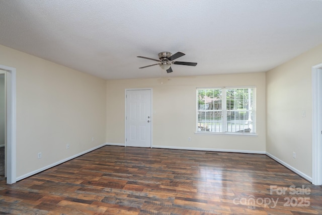 unfurnished room featuring ceiling fan, wood finished floors, and baseboards