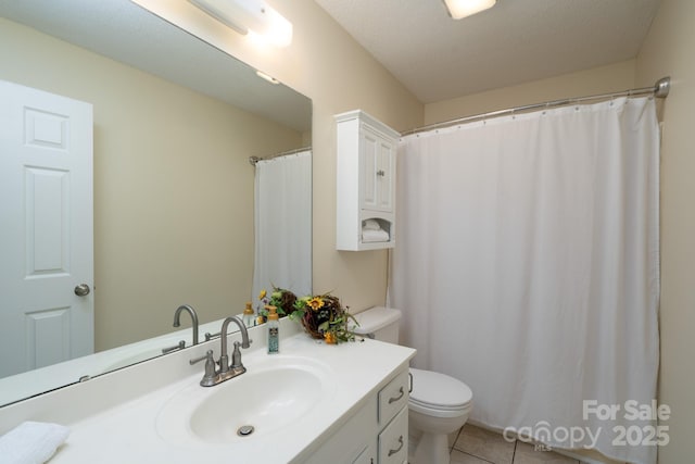 full bathroom featuring vanity, toilet, and tile patterned flooring