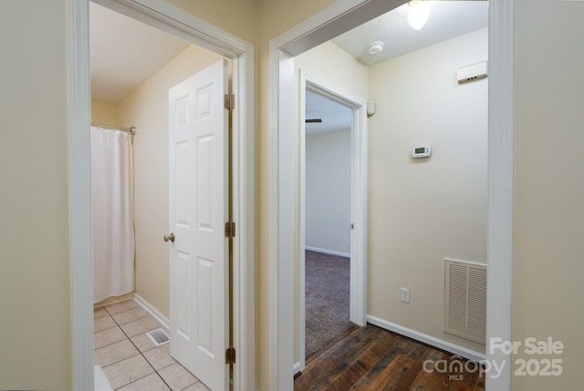 corridor featuring baseboards