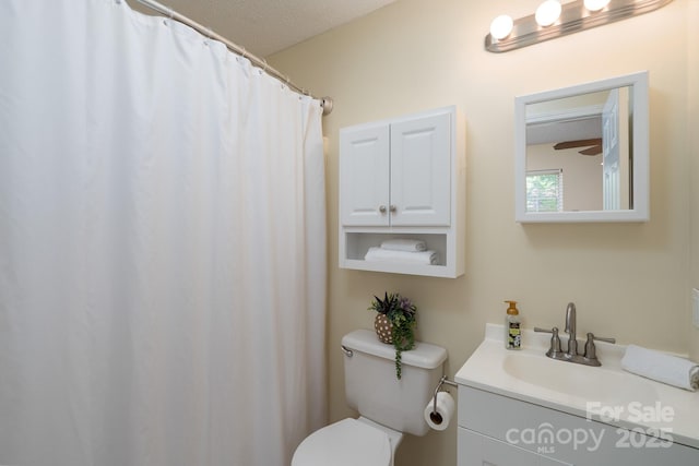 full bathroom featuring toilet and vanity