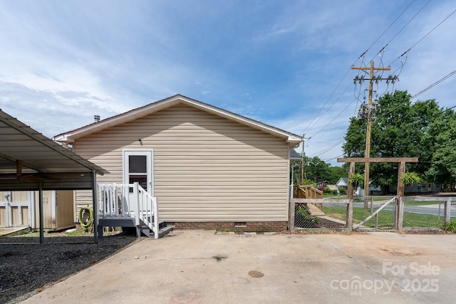 view of side of home with crawl space