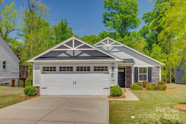 craftsman inspired home with a front yard, stone siding, a garage, board and batten siding, and driveway