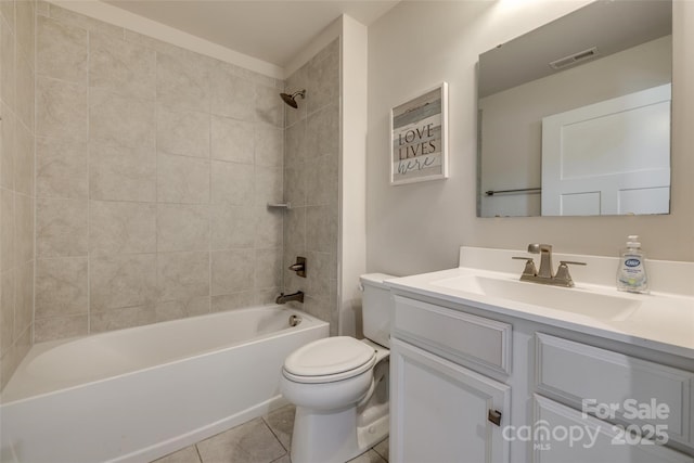bathroom with tile patterned floors, bathing tub / shower combination, toilet, visible vents, and vanity