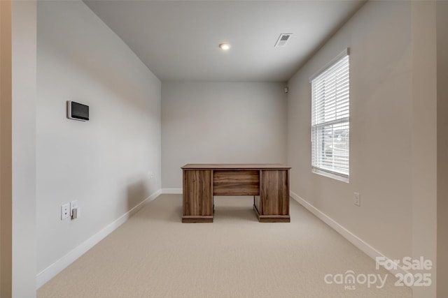 unfurnished office with recessed lighting, visible vents, baseboards, and light carpet