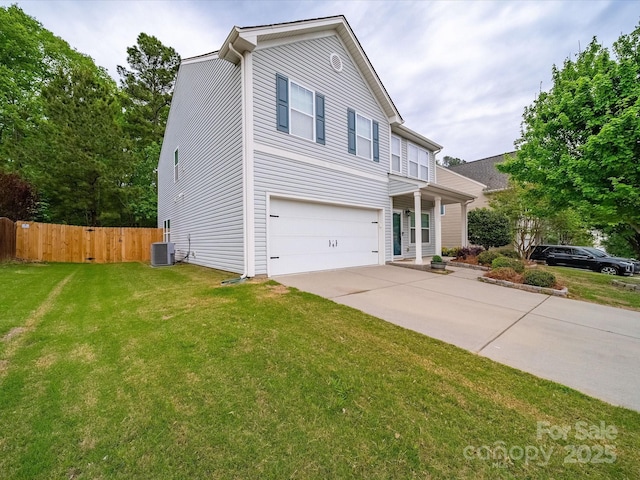113 Devynn Ridge Ct, Mount Holly, NC 28120 - traditional home featuring fence, central air condition unit, driveway, a front yard, and an attached garage