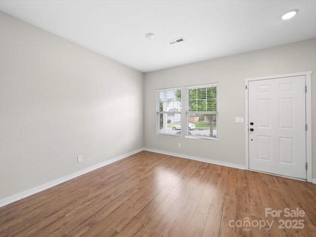 113 Devynn Ridge Ct, Mount Holly, NC 28120 - interior space featuring visible vents, wood finished floors, and baseboards