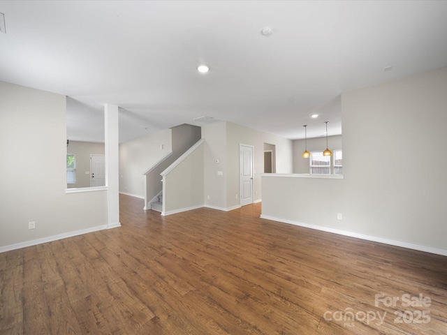113 Devynn Ridge Ct, Mount Holly, NC 28120 - unfurnished living room featuring recessed lighting, stairway, wood finished floors, and baseboards