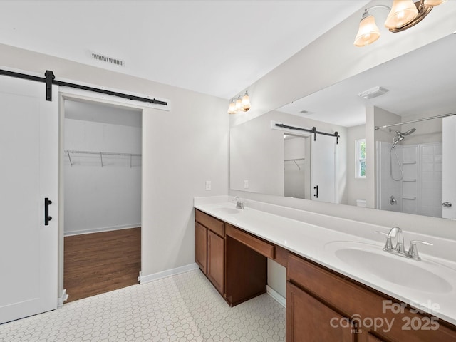 113 Devynn Ridge Ct, Mount Holly, NC 28120 - bathroom featuring double vanity, a sink, tile patterned floors, and visible vents