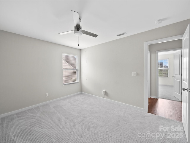 113 Devynn Ridge Ct, Mount Holly, NC 28120 - carpeted spare room featuring baseboards, visible vents, and a ceiling fan