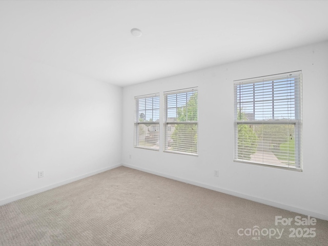 113 Devynn Ridge Ct, Mount Holly, NC 28120 - spare room featuring carpet flooring and baseboards