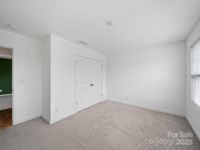 113 Devynn Ridge Ct, Mount Holly, NC 28120 - empty room with baseboards, visible vents, and carpet flooring