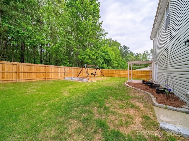 113 Devynn Ridge Ct, Mount Holly, NC 28120 - view of yard with a fenced backyard and a playground