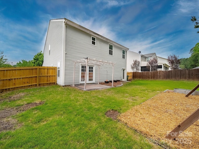 113 Devynn Ridge Ct, Mount Holly, NC 28120 - rear view of house with a fenced backyard, a yard, a patio area, french doors, and a pergola