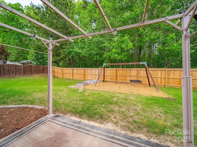113 Devynn Ridge Ct, Mount Holly, NC 28120 - view of yard with a fenced backyard and a playground
