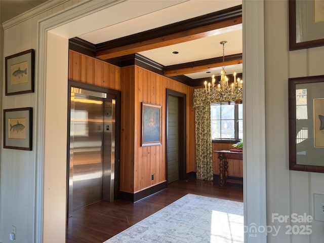 kitchen featuring wood walls, beam ceiling, elevator, dark wood-style floors, and an inviting chandelier