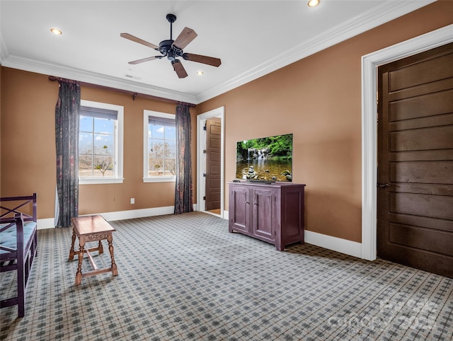 unfurnished room featuring a ceiling fan, crown molding, baseboards, and visible vents