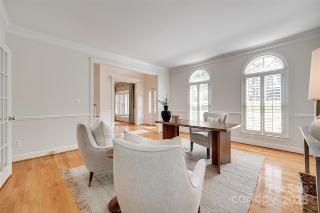 home office with baseboards, ornamental molding, and light wood finished floors