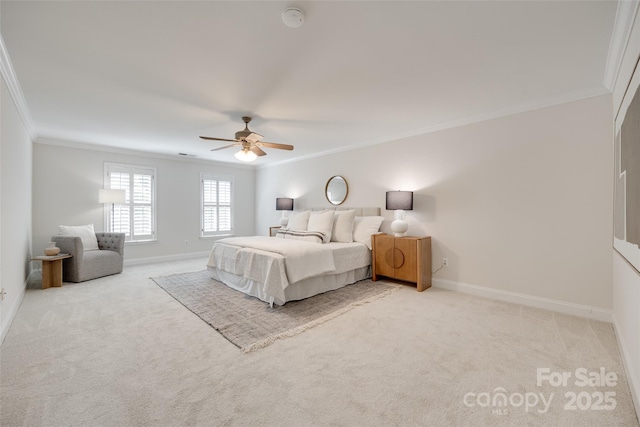 bedroom featuring crown molding, baseboards, and light colored carpet