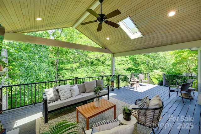 wooden terrace featuring ceiling fan and an outdoor hangout area