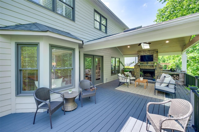 wooden terrace featuring an outdoor living space with a fireplace