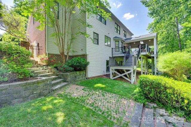exterior space featuring a wooden deck and stairs