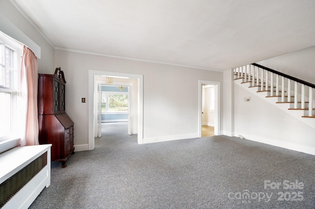 10 Westchester Dr, Asheville, NC 28803 - unfurnished living room with baseboards, stairway, crown molding, radiator heating unit, and carpet