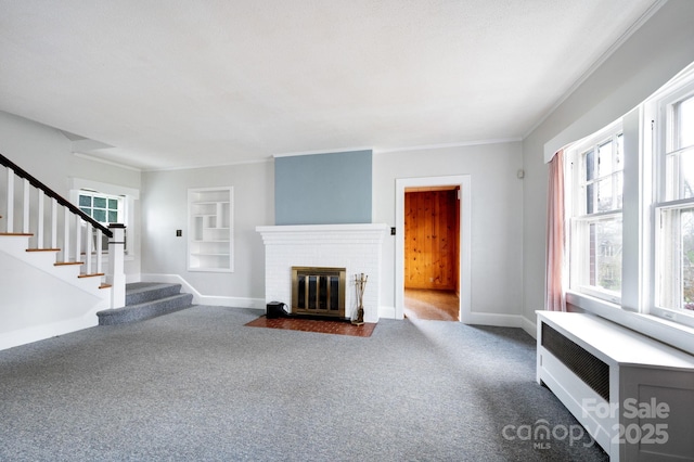 10 Westchester Dr, Asheville, NC 28803 - unfurnished living room featuring radiator heating unit, carpet, a fireplace, and stairs