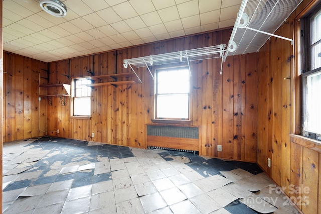 10 Westchester Dr, Asheville, NC 28803 - additional living space featuring tile patterned floors, wooden walls, and a wealth of natural light