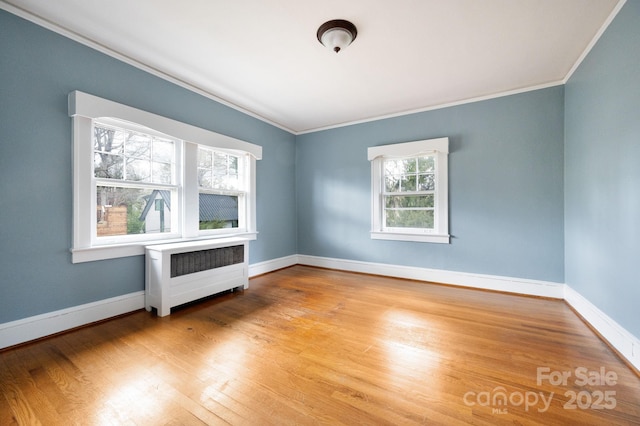 10 Westchester Dr, Asheville, NC 28803 - unfurnished room featuring baseboards, crown molding, radiator, and wood finished floors