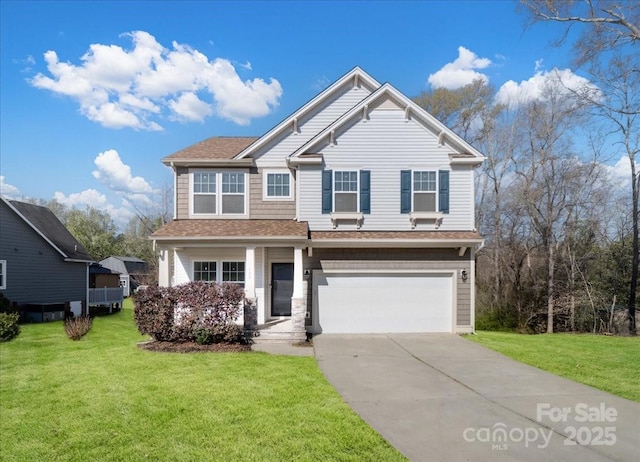 view of front of property with a shingled roof, driveway, a front yard, and a garage