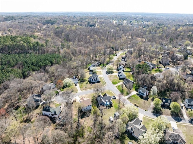 bird's eye view featuring a view of trees and a residential view