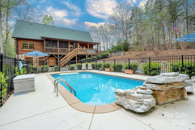 view of pool featuring stairway, a fenced in pool, and a fenced backyard