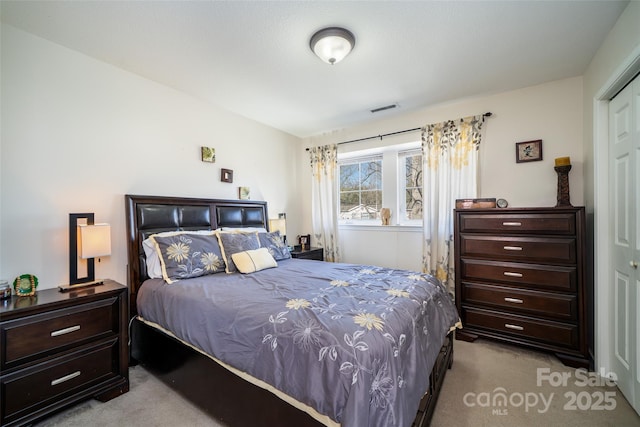 bedroom with carpet and visible vents