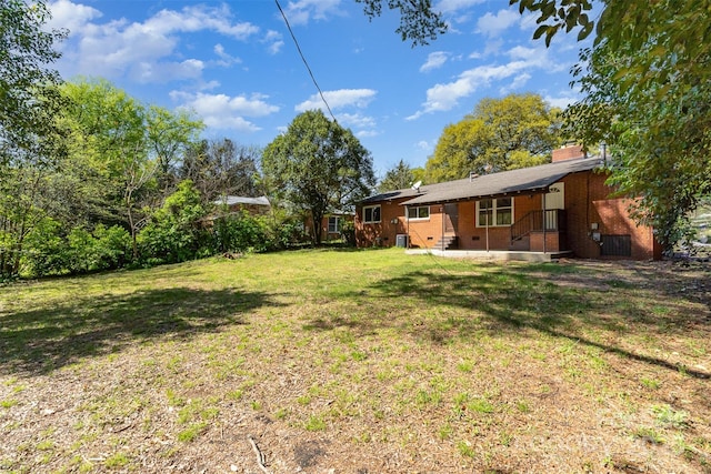 900 E Woodlawn Rd, Charlotte, NC 28209 - view of grassy yard with a patio