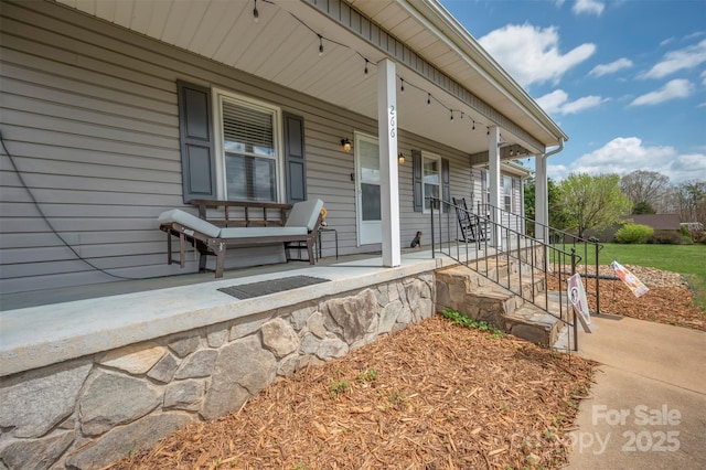 266 Asheland Dr, Ellenboro, NC 28040 - view of exterior entry featuring a porch