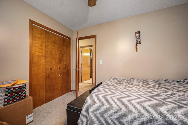 266 Asheland Dr, Ellenboro, NC 28040 - bedroom with a textured ceiling, a closet, light colored carpet, and ceiling fan