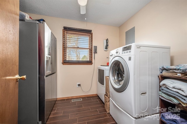266 Asheland Dr, Ellenboro, NC 28040 - laundry area with laundry area, a textured ceiling, visible vents, wood tiled floor, and washer and dryer