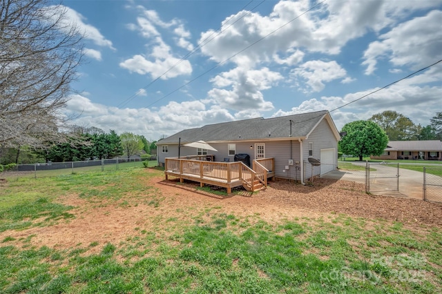 266 Asheland Dr, Ellenboro, NC 28040 - back of property featuring concrete driveway, a gate, an attached garage, a deck, and fence