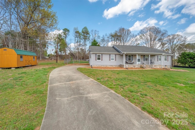 266 Asheland Dr, Ellenboro, NC 28040 - view of front of house featuring driveway, a front lawn, a shed, a porch, and an outbuilding
