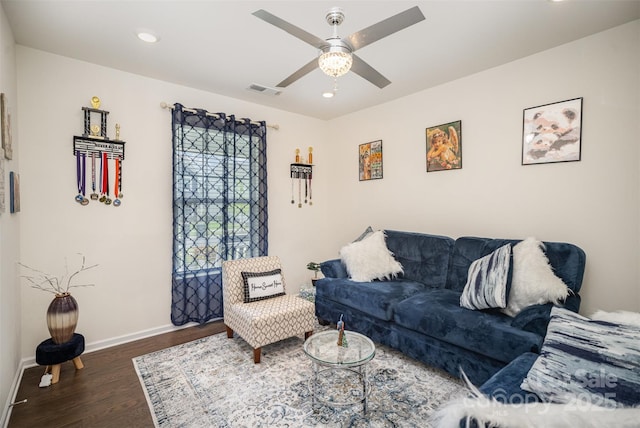 living room featuring ceiling fan, baseboards, wood finished floors, and recessed lighting